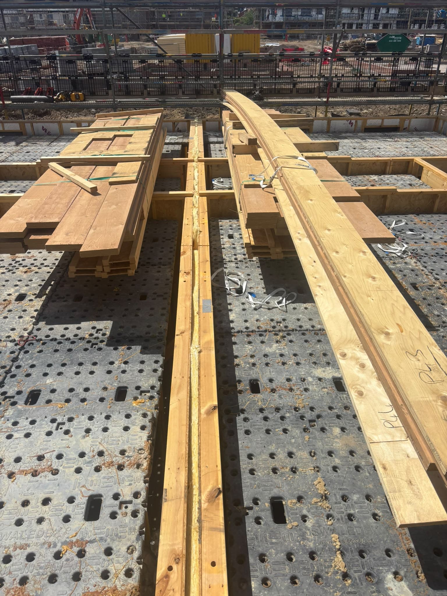 Timber panels and roof components ready for installation